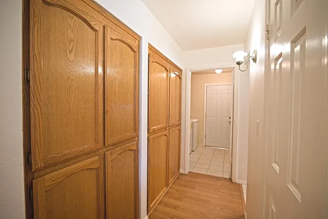 a bathroom with a glass shower door and a mirror