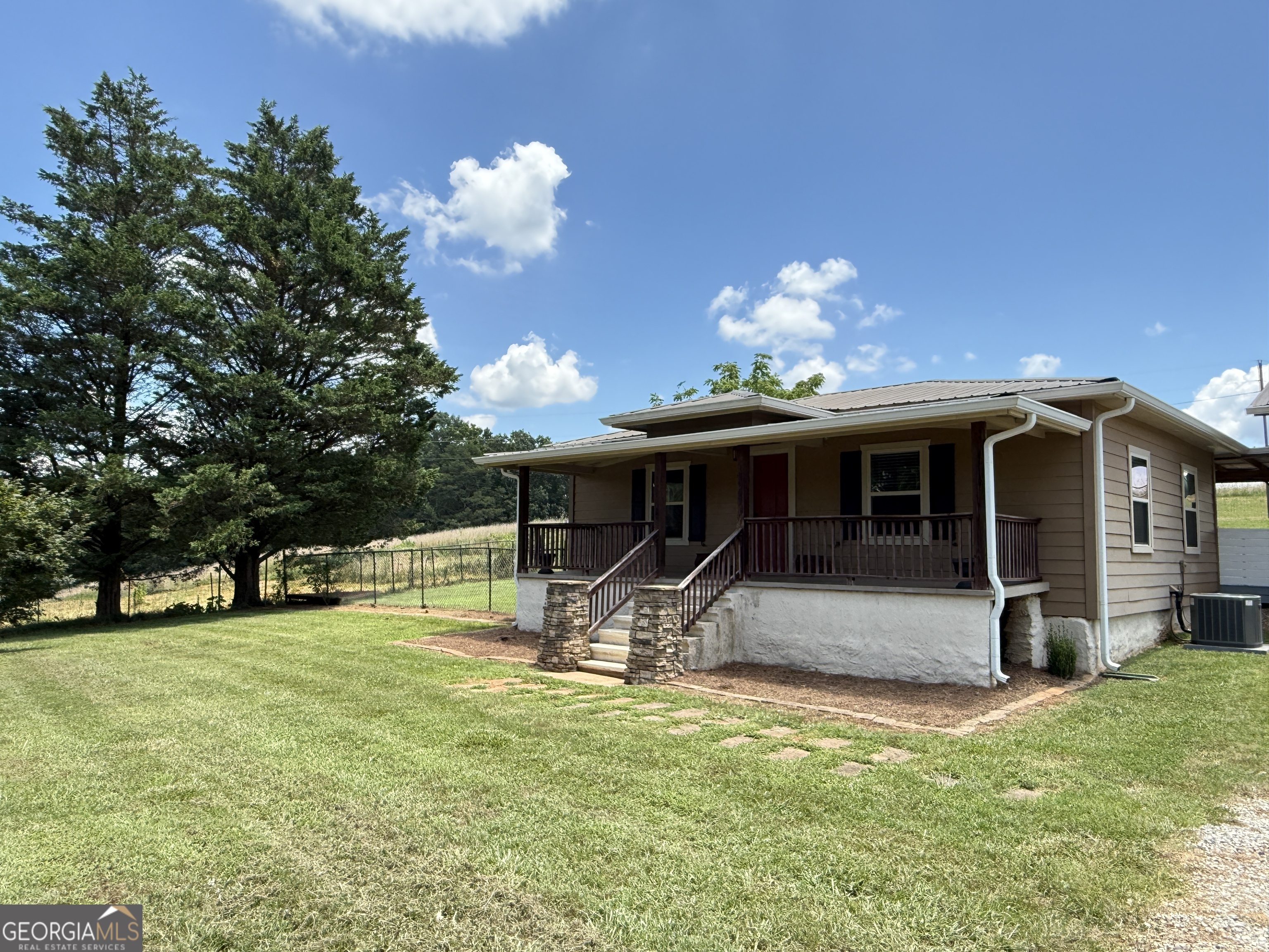 1092 May White Road Cleveland, GA 30528 - Photo 1 of 1 a house view with a garden space