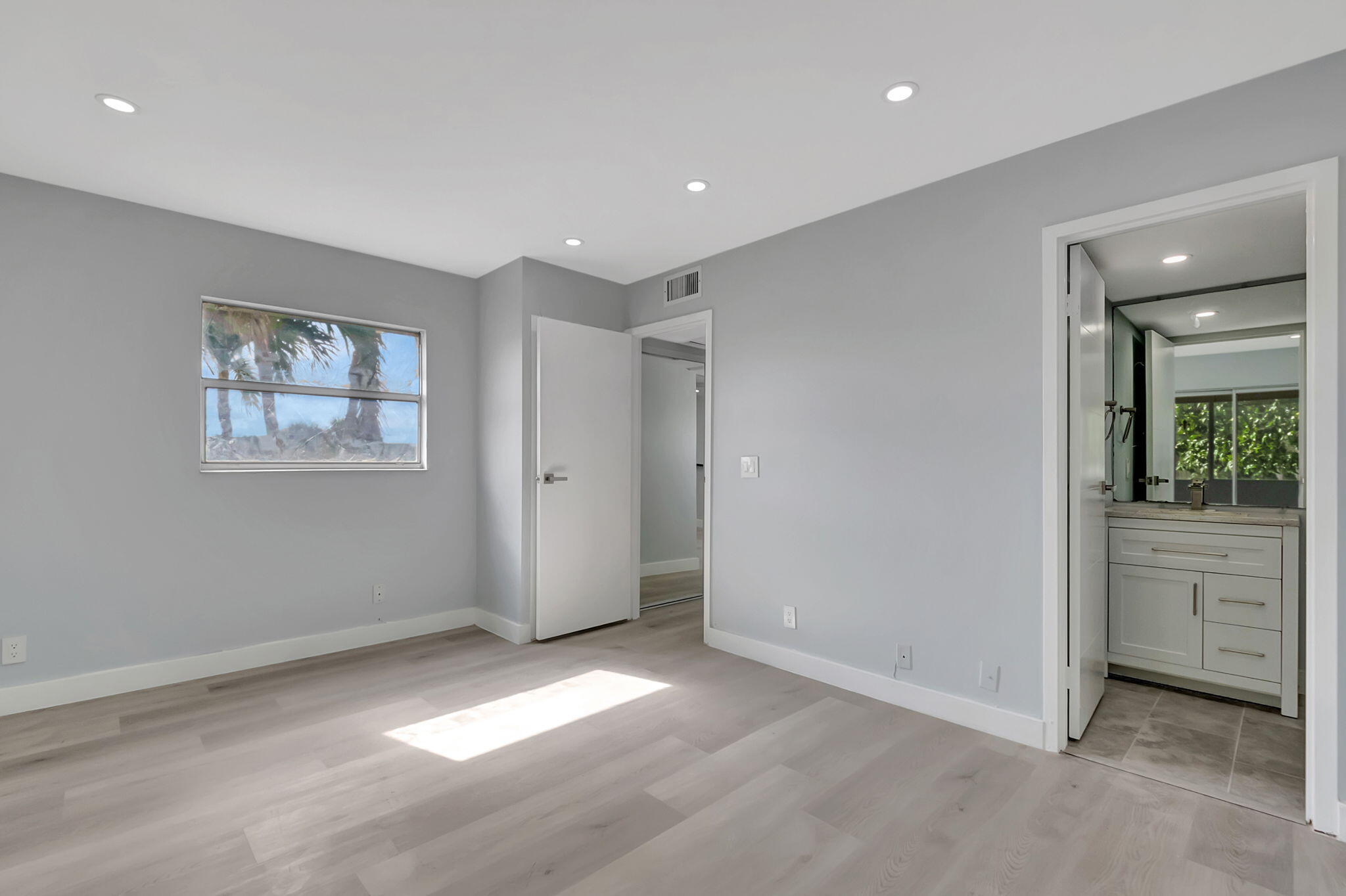 171 Monaco Way Delray Beach, FL 33446 - Photo 20 of 58 wooden floor in an empty room with a window