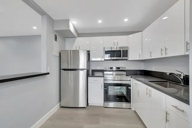 a view of a house with brick walls