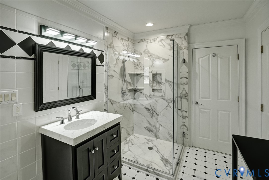 721 Meadow View Ridge Manakin-Sabot, VA 23103 - Photo 43 of 45 a bathroom with a sink vanity granite shower and a mirror