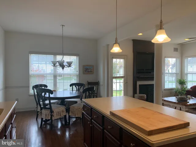 a kitchen with a table and chairs in it