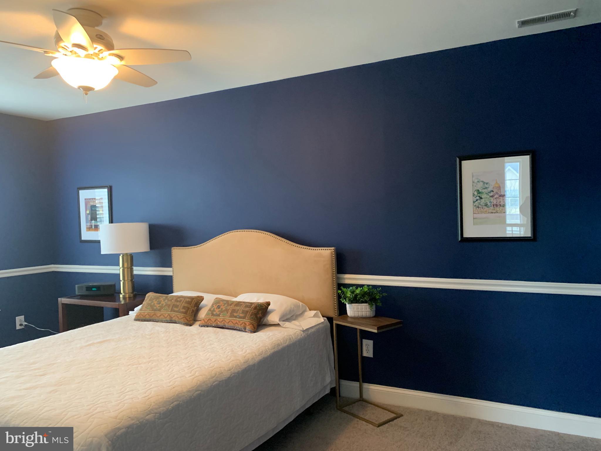 2 Zion Drive Berlin, NJ 08009 - Photo 25 of 37 a bedroom with a bed and a lamp