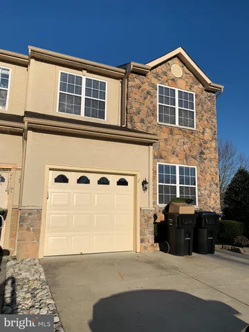 a front view of a house with parking