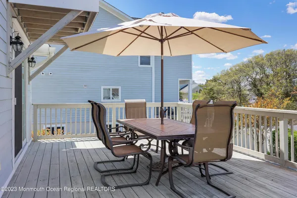 a view of balcony with furniture and wooden floor