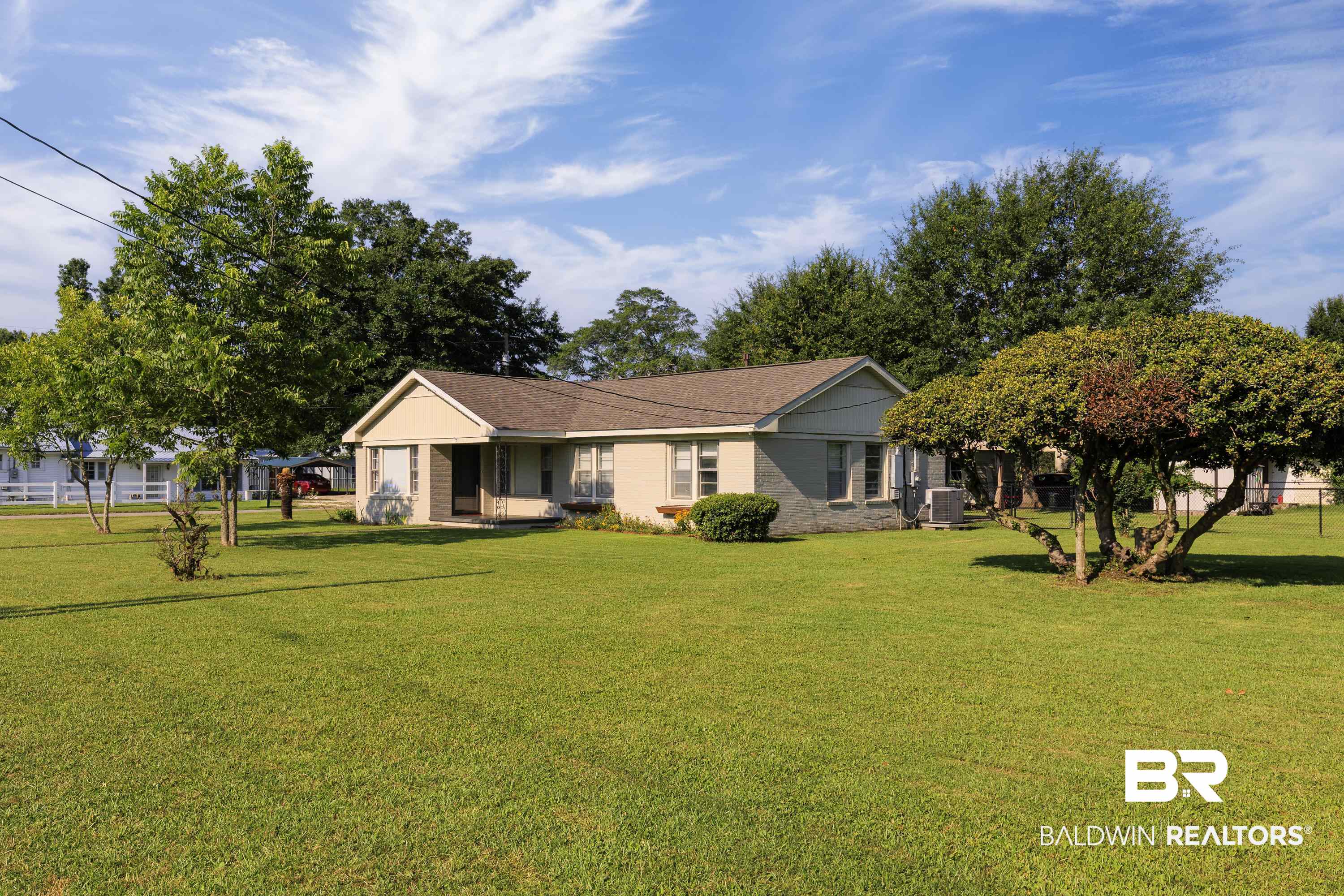 208 Beck Street Atmore, AL 36502 - Photo 3 of 26 View of front of house with a front yard