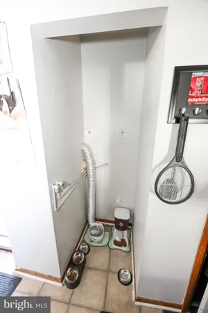 a bathroom with a toilet and a mirror