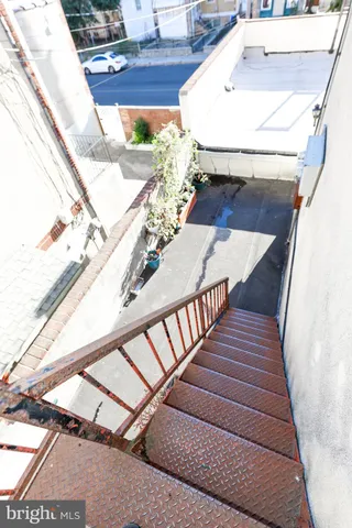 a view of staircase with a rug