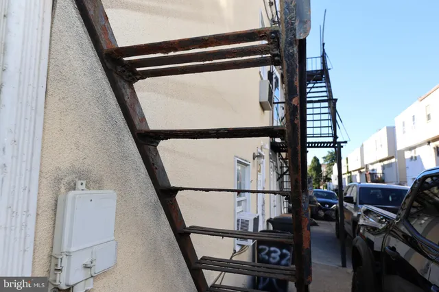 a view of living room with furniture and a window