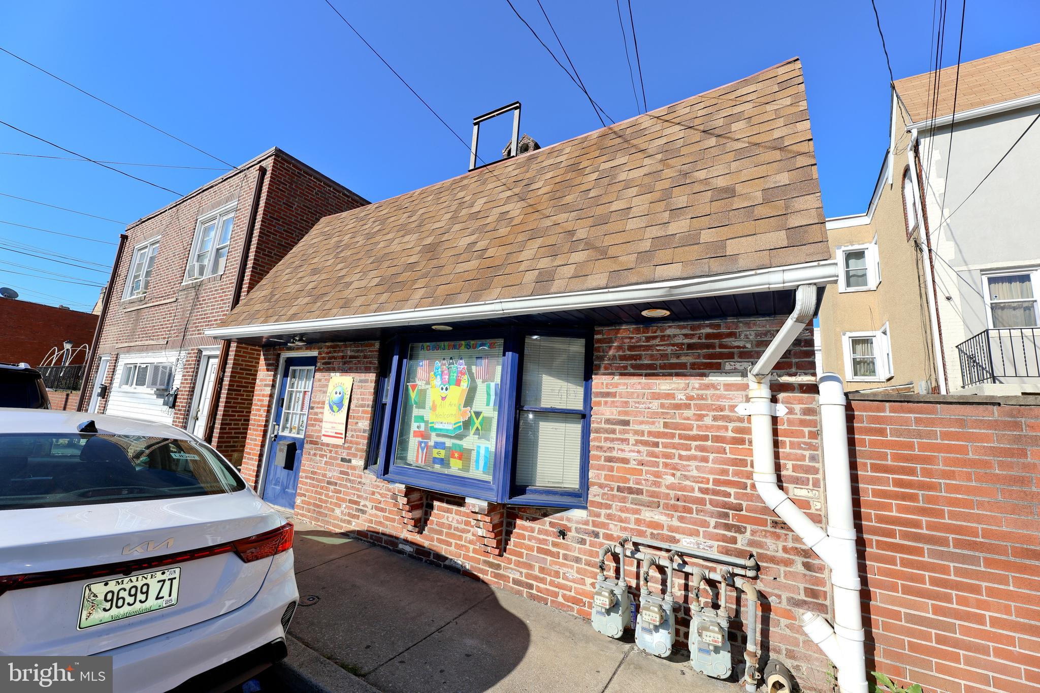 232 Long Lane Upper Darby, PA 19082 - Photo 2 of 29 a backyard of a house with barbeque oven table and chairs