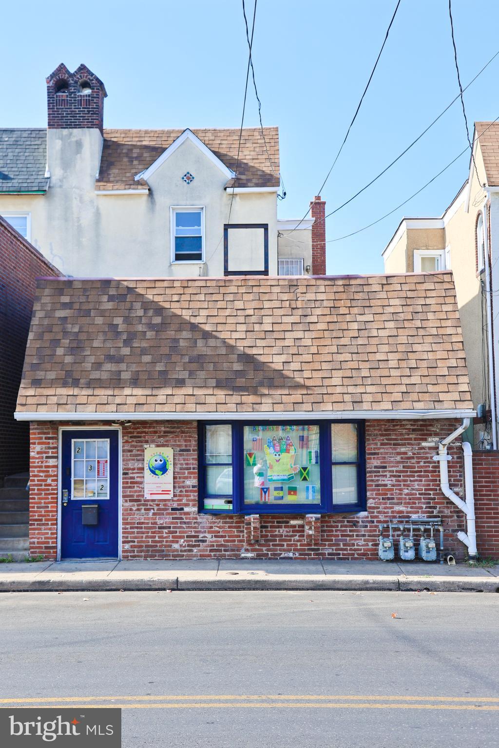 232 Long Lane Upper Darby, PA 19082 - Photo 29 of 29 a front view of a house with a yard and garage
