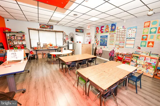 a outdoor dining area with furniture and wooden floor