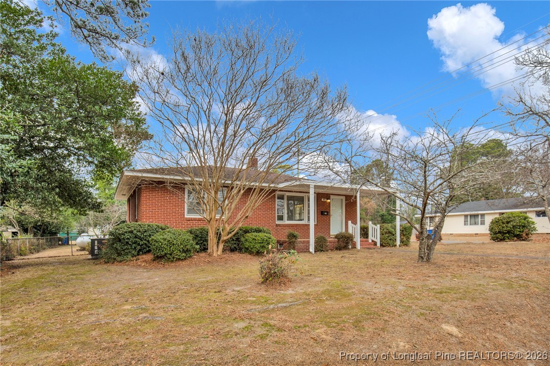 400 Roxie Avenue Fayetteville, NC 28304 - Photo 1 of 33 a front view of a house with a yard