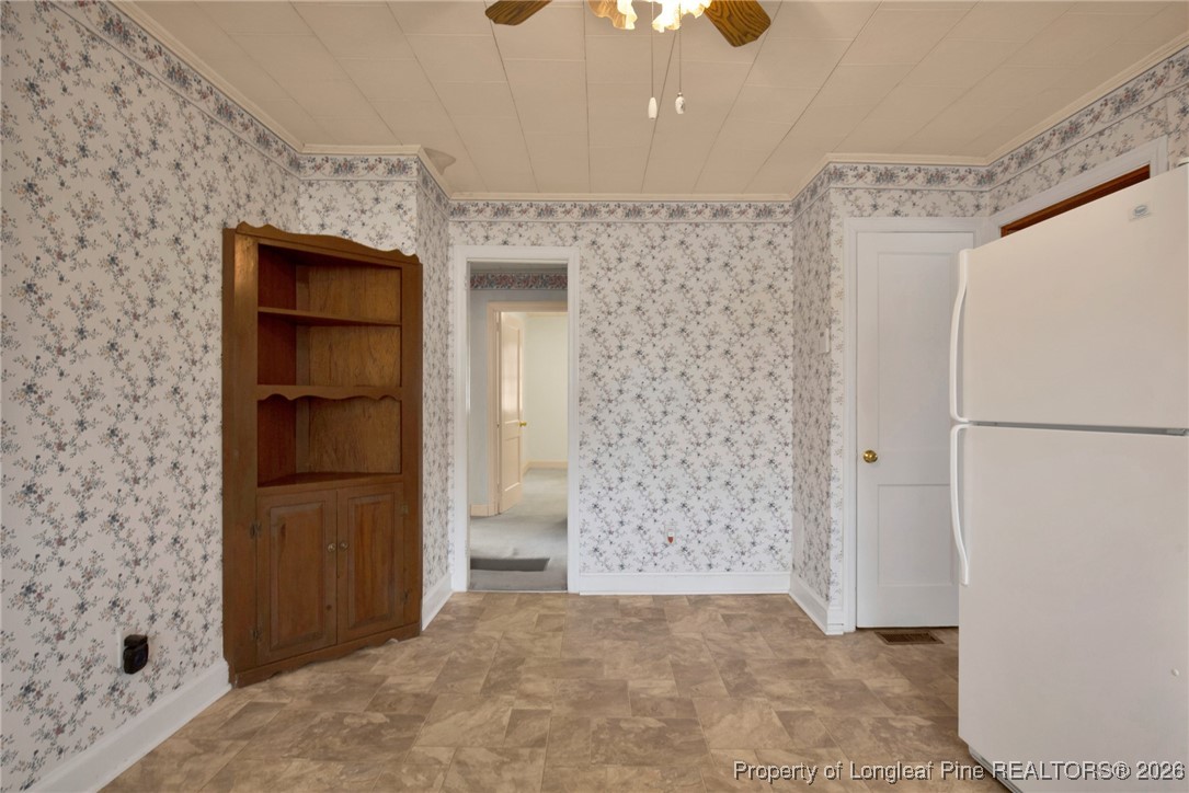 400 Roxie Avenue Fayetteville, NC 28304 - Photo 13 of 33 a view of a hallway with closet and cabinet