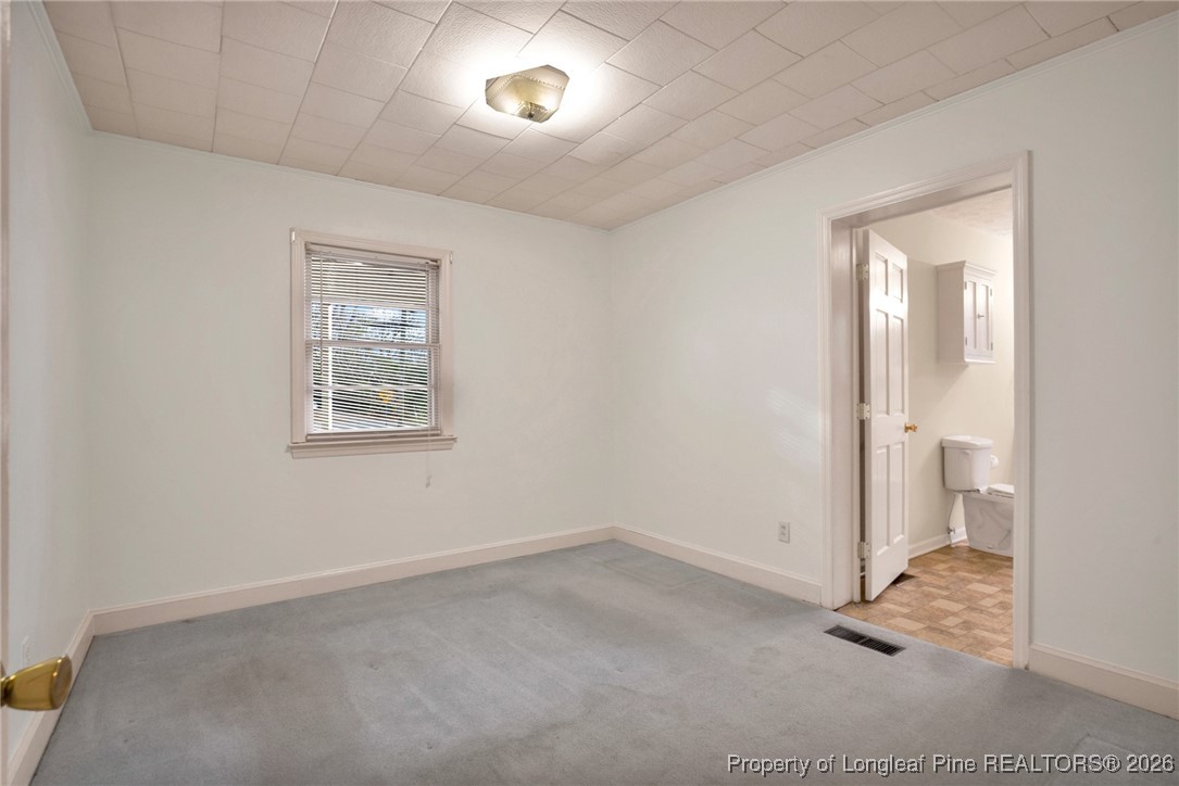 400 Roxie Avenue Fayetteville, NC 28304 - Photo 17 of 33 an empty room with a empty space and windows