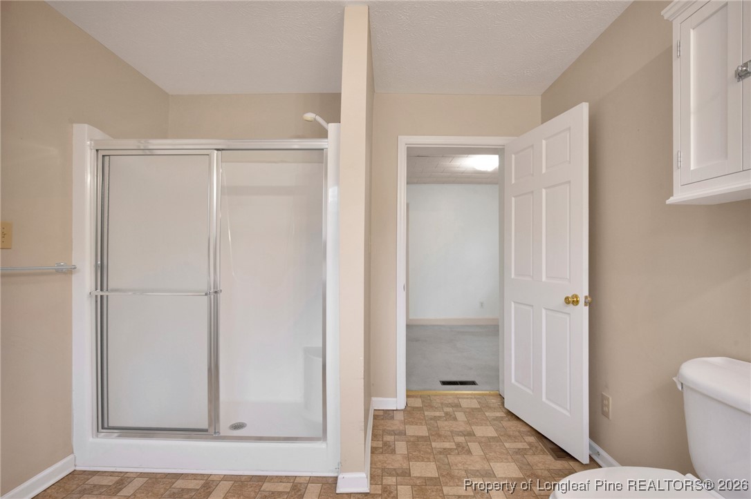 400 Roxie Avenue Fayetteville, NC 28304 - Photo 20 of 33 a bathroom with a shower and a toilet