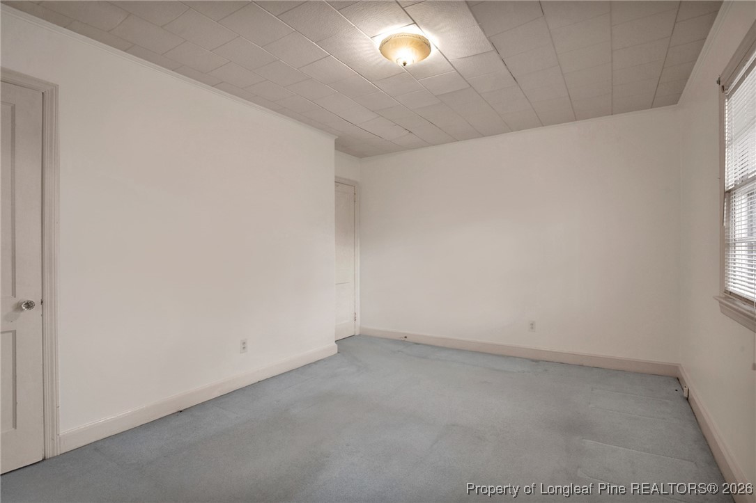 400 Roxie Avenue Fayetteville, NC 28304 - Photo 22 of 33 an empty room with a empty space and a window