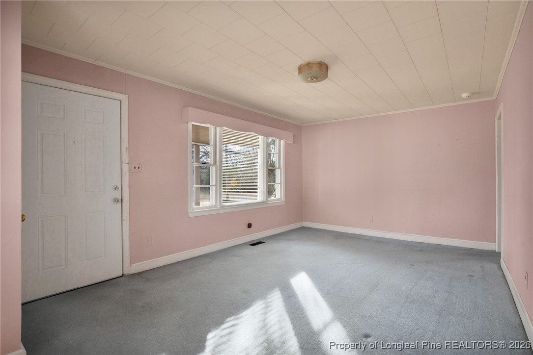 400 Roxie Avenue Fayetteville, NC 28304 - Photo 5 of 33 an empty room with windows