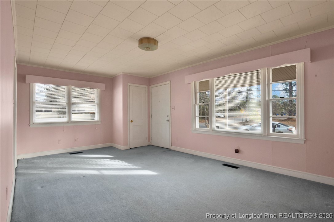 400 Roxie Avenue Fayetteville, NC 28304 - Photo 6 of 33 an empty room with windows