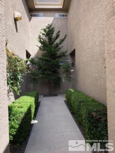 900 S Meadows, Unit 5513 Reno, NV 89521 - Photo 2 of 16 a view of a pathway both side of house
