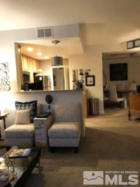 900 S Meadows, Unit 5513 Reno, NV 89521 - Photo 8 of 16 a living room with furniture and a flat screen tv
