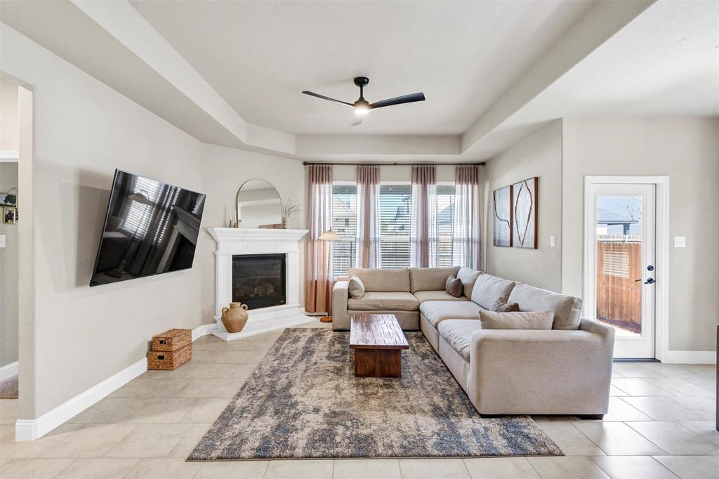 5241 Ranchero Trail Fort Worth, TX 76126 - Photo 14 of 29 a living room with furniture fireplace and a flat screen tv