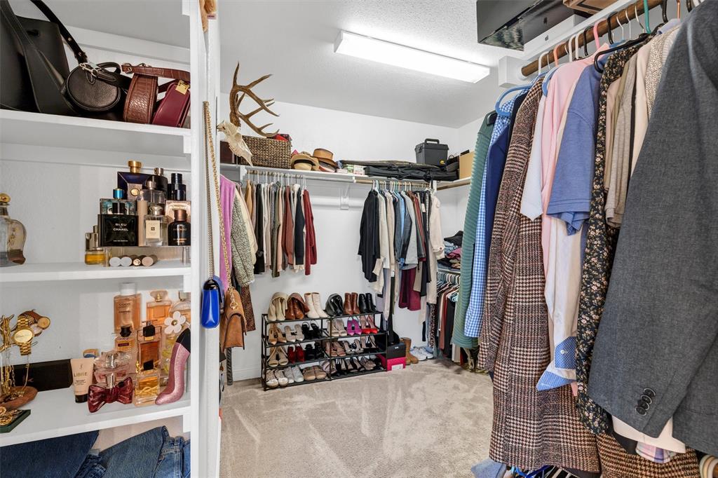5241 Ranchero Trail Fort Worth, TX 76126 - Photo 20 of 29 a view of walk in closet with clothes and shoes