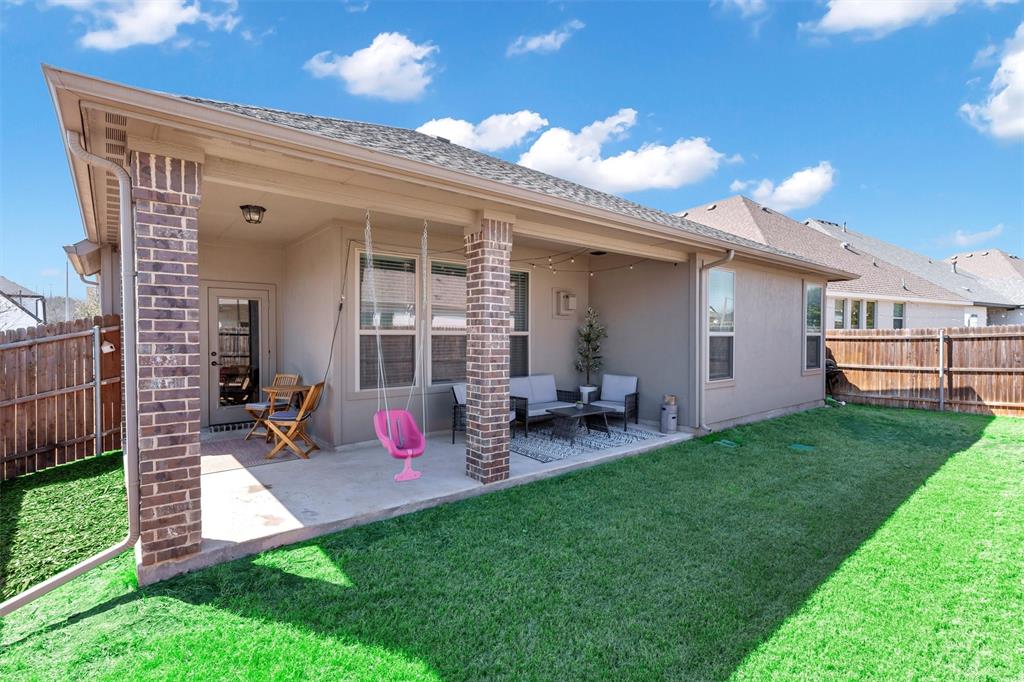 5241 Ranchero Trail Fort Worth, TX 76126 - Photo 24 of 29 a view of a chair and table in backyard of the house