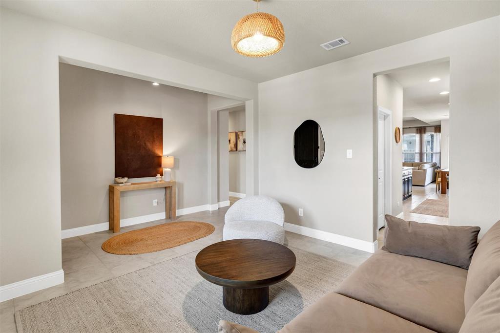 5241 Ranchero Trail Fort Worth, TX 76126 - Photo 5 of 29 a living room with furniture a rug and a mirror