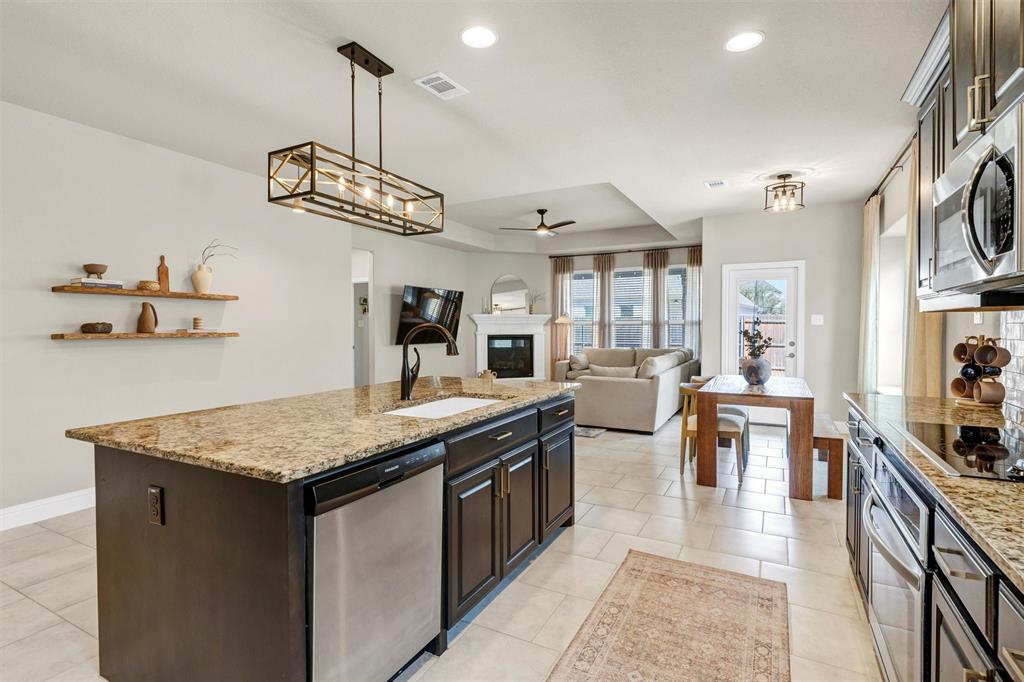 5241 Ranchero Trail Fort Worth, TX 76126 - Photo 8 of 29 a kitchen with stainless steel appliances granite countertop lots of counter top space