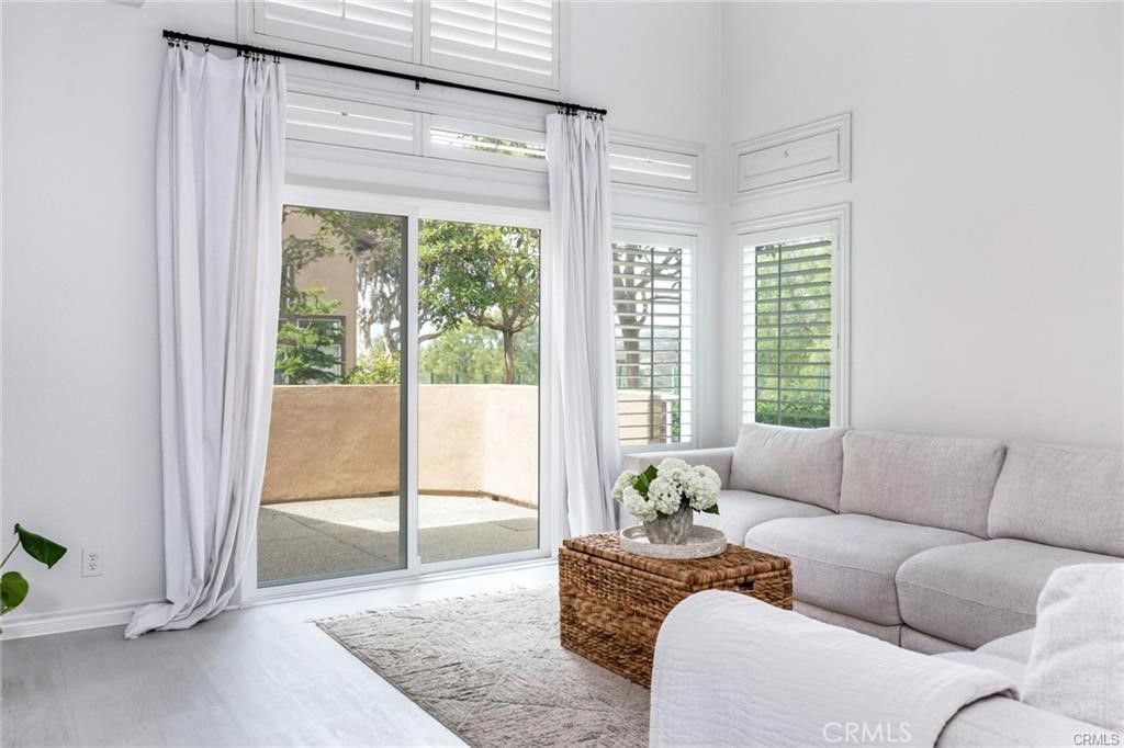 1 Baycrest Place Dana Point, CA 92629 - Photo 7 of 20 a living room with furniture and a floor to ceiling window
