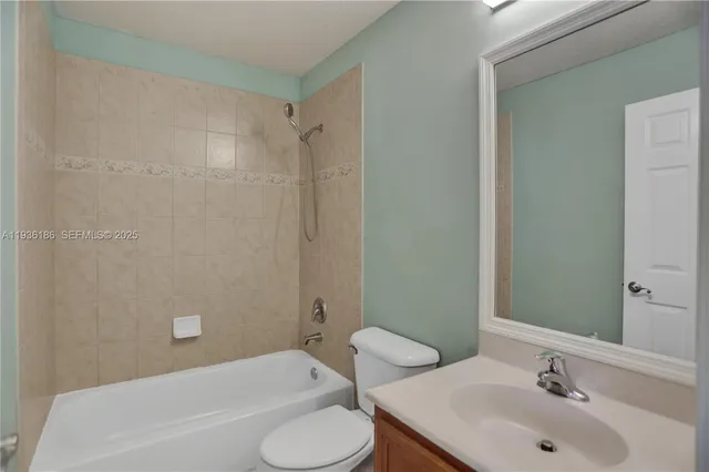 a bathroom with a sink and toilet