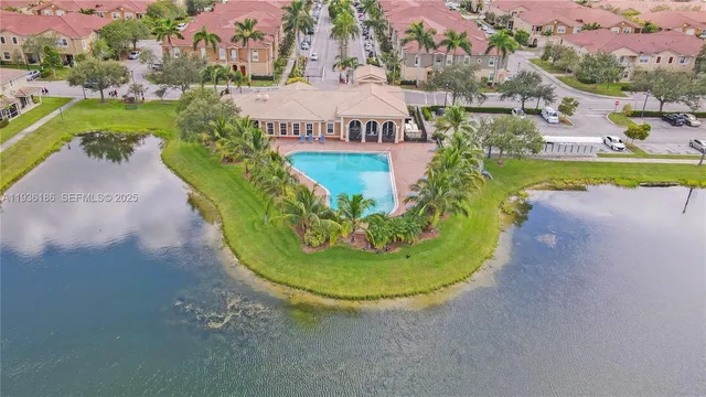 a view of a swimming pool in front of the house