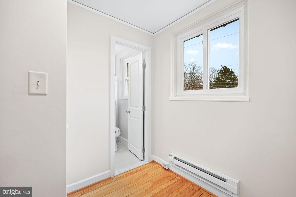 13 Ridge Road Greenbelt, MD 20770 - Photo 11 of 32 a view of room with window and wooden floor