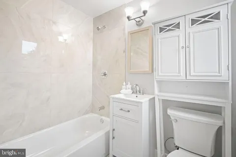 a bathroom with a sink a toilet and a bathtub