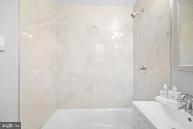 a bathroom with a sink and a bathtub