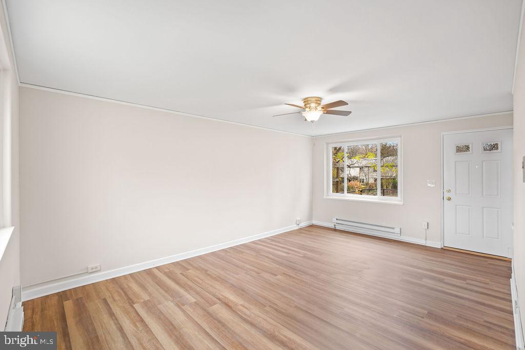13 Ridge Road Greenbelt, MD 20770 - Photo 20 of 32 wooden floor in an empty room with a window