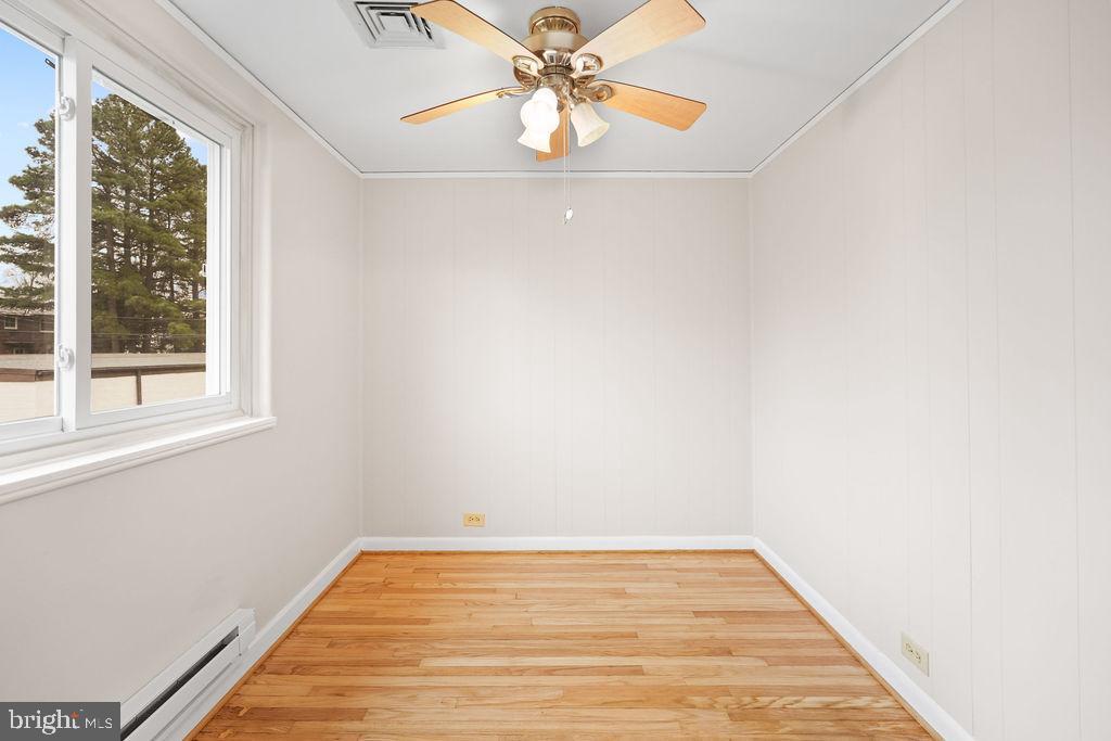 13 Ridge Road Greenbelt, MD 20770 - Photo 26 of 32 a view of a room with wooden floor and a window