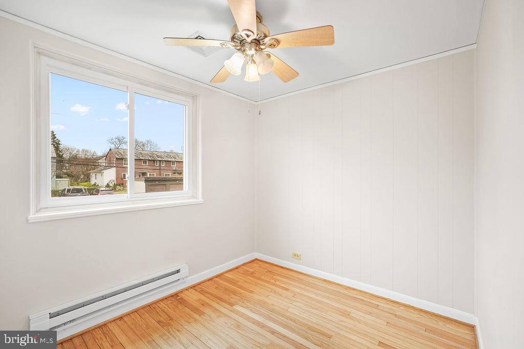 13 Ridge Road Greenbelt, MD 20770 - Photo 27 of 32 an empty room with a window and a fan