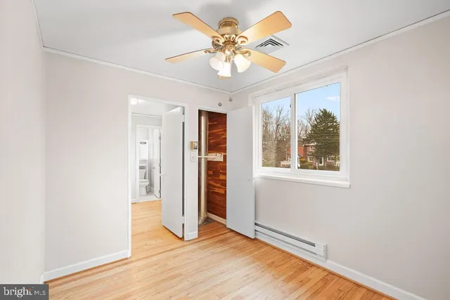 a view of an empty room with a window