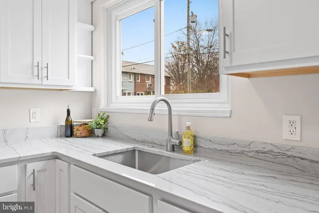 a kitchen with a sink and cabinets