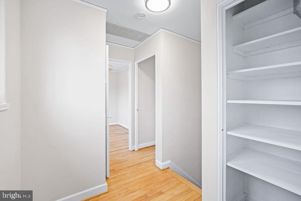 13 Ridge Road Greenbelt, MD 20770 - Photo 10 of 32 a view of a bedroom with wooden floor and closet