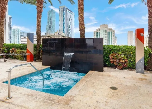 an outdoor space with chairs and wooden floor