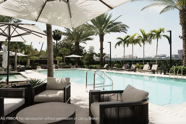 a balcony with furniture and a potted plant