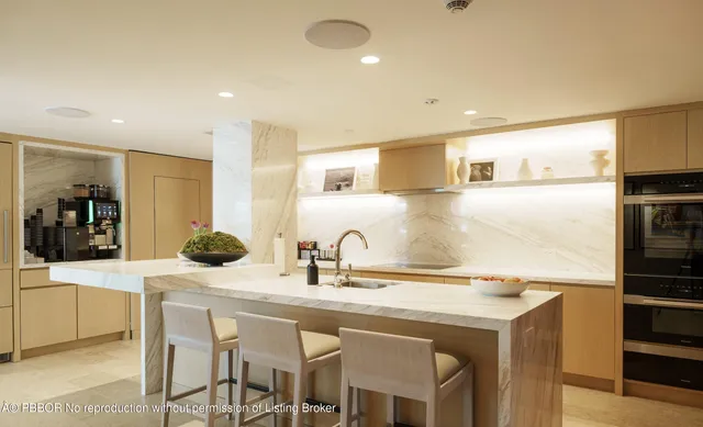 a kitchen with a sink and refrigerator