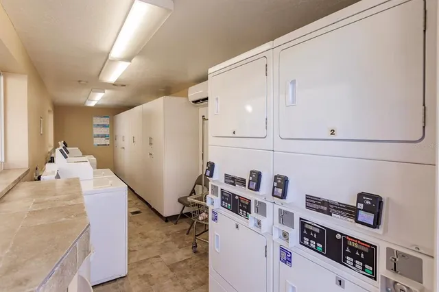 a view of kitchen and utility room with refrigerator