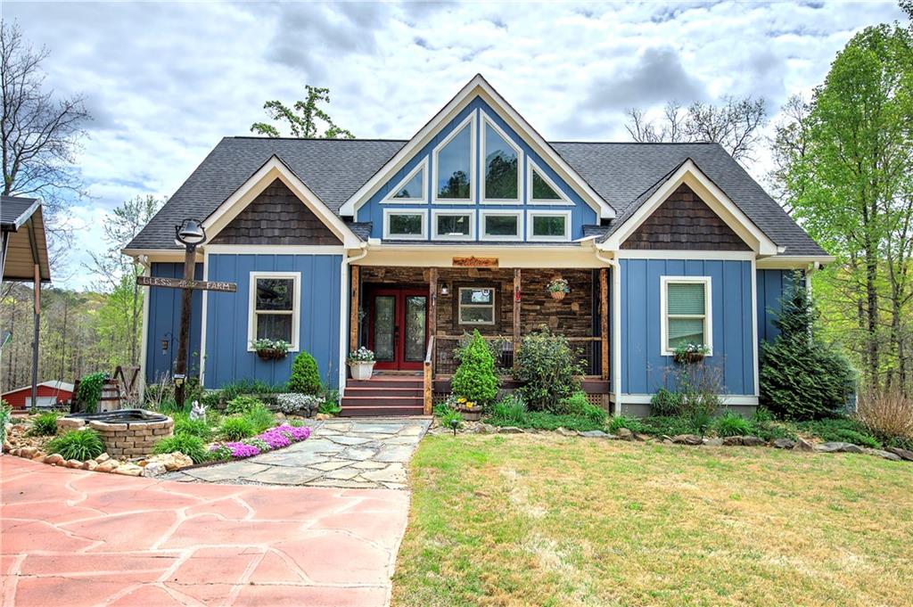 100 Buckwood Farms Path Dallas, GA 30132 - Photo 2 of 70 a front view of a house with garden