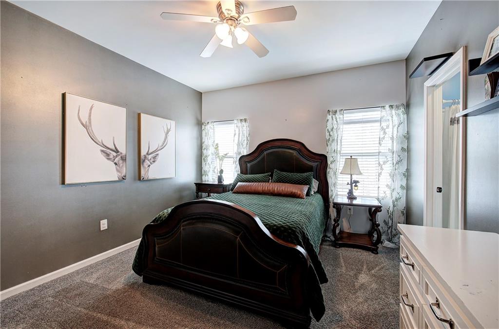100 Buckwood Farms Path Dallas, GA 30132 - Photo 21 of 70 a bedroom with a bed and window