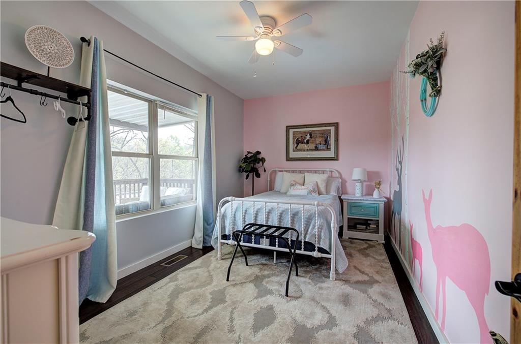 100 Buckwood Farms Path Dallas, GA 30132 - Photo 22 of 70 a bedroom with a bed furniture and a window