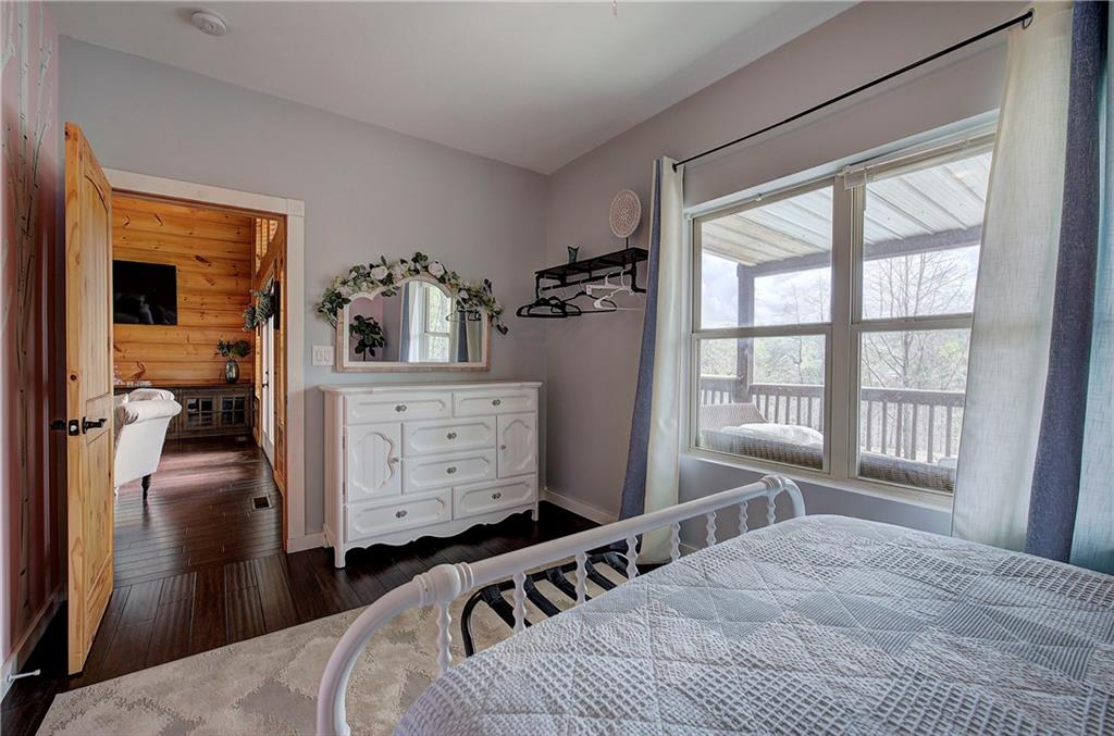 100 Buckwood Farms Path Dallas, GA 30132 - Photo 23 of 70 a bedroom with a bed a window and dresser